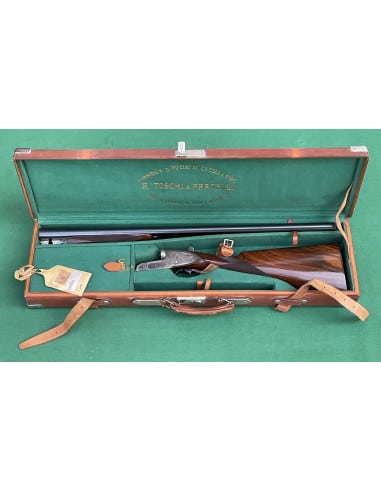 Doppietta F.lli Toschi calibro 12 Canne 70cm.  Bascula finemente incisa e tartarugata.