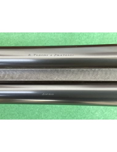 Doppietta F.lli Toschi calibro 12 Canne 70cm.  Bascula finemente incisa e tartarugata.